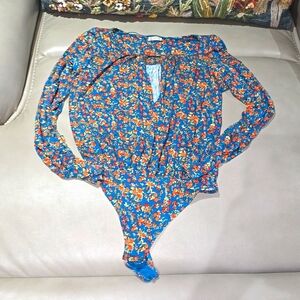 Free People brand long sleeve thong bodysuit. Size small
